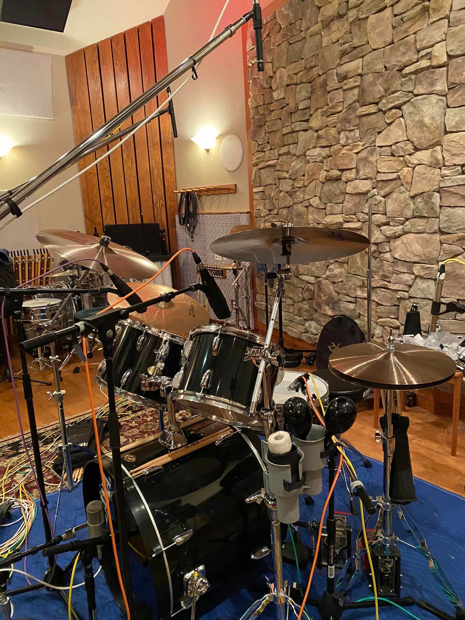 A full drum set, in the studio